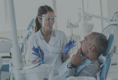 Patient talking to dentist about dental treatment options
