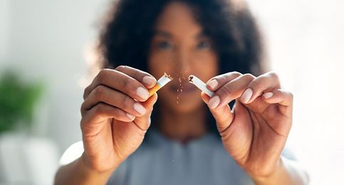 Closeup of patient breaking cigarette