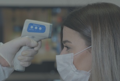Dentist taking patient's temperature
