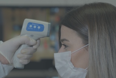 Dentist taking patient's temperature