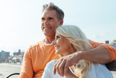 Man and woman smiling after visiting the dentist