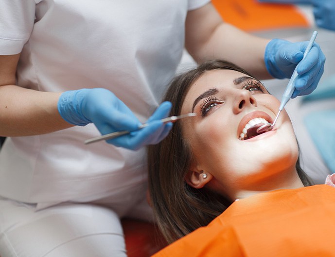 Dentist smiling at dental patient