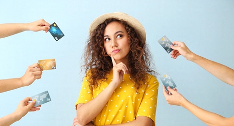 Woman surrounded by credit cards