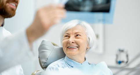 patient talking to dentist about dental X-ray   