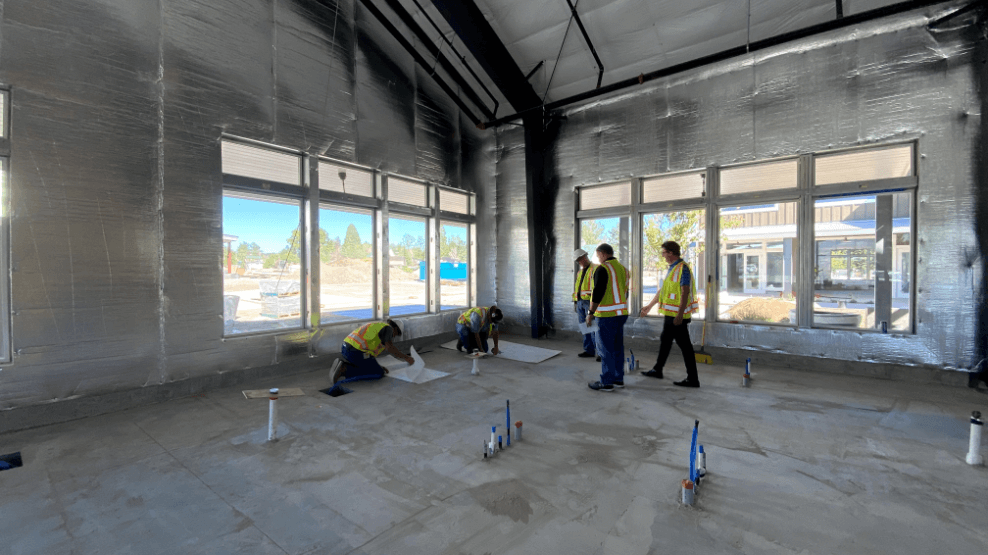 Construction team working dental office flooring