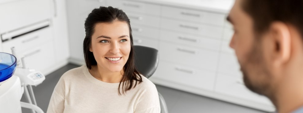 Woman in dental chair during preventive dentistry exam