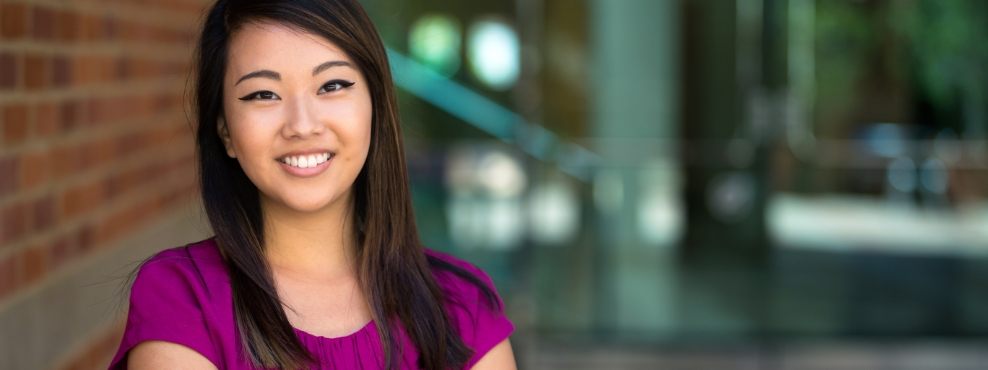 Young woman with perfectly aligned smile after orthodontic treatment