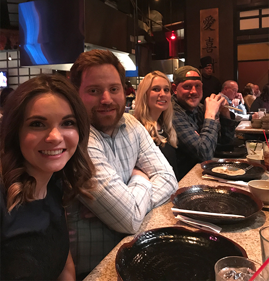 Group of dental team members  eating dinner together