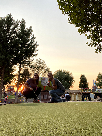 Dental team members playing mini golf