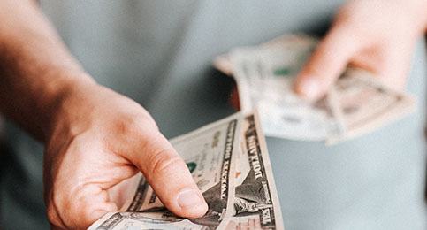 Man holding cash for payment