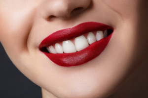a closeup of a person wearing red lipstick